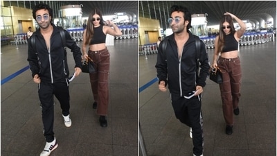 Tara's black sleeveless top comes with a round neckline, bodycon fitting and a cropped hem accentuating her toned midriff. The actor teamed it with brown-coloured cargo pants featuring contrast white lining, pockets on the side, a high-rise waist, and a straight-fitted silhouette. (HT Photo/Varinder Chawla) Tara's black sleeveless top comes with a round neckline, bodycon fitting and a cropped hem accentuating her toned midriff. The actor teamed it with brown-coloured cargo pants featuring contrast white lining, pockets on the side, a high-rise waist, and a straight-fitted silhouette. (HT Photo/Varinder Chawla)