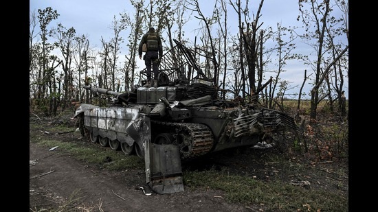 This photograph taken on September 11, 2022, shows a Ukranian soldier standing atop an abandoned Russian tank near a village on the outskirts of Izyum, Kharkiv Region, eastern Ukraine, amid the Russian invasion of Ukraine (AFP) This photograph taken on September 11, 2022, shows a Ukranian soldier standing atop an abandoned Russian tank near a village on the outskirts of Izyum, Kharkiv Region, eastern Ukraine, amid the Russian invasion of Ukraine (AFP)