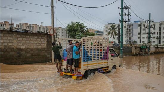 A truck drives through flood water, in Bengaluru. (Bloomberg)