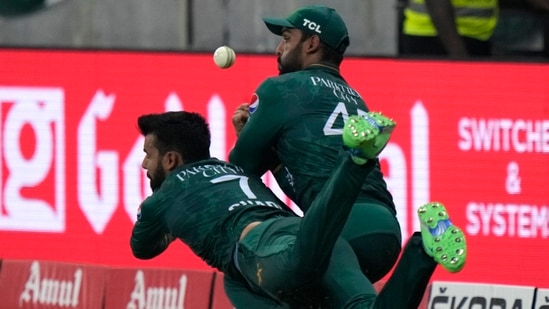 Pakistan's Shadab Khan, left, and Asif Ali collide in an unsuccessful attempt to take the catch of Sri Lanka's Bhanuka Rajapaksa(AP) Pakistan's Shadab Khan, left, and Asif Ali collide in an unsuccessful attempt to take the catch of Sri Lanka's Bhanuka Rajapaksa(AP)