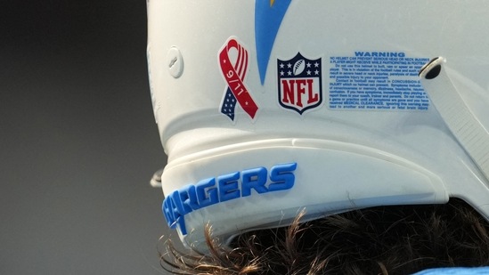 A detailed view of the 9/11 ribbon logo on the back of the helmet of Los Angeles Chargers quarterback Justin Herbert (10) at SoFi Stadium.(Kirby Lee/USA TODAY Sports)