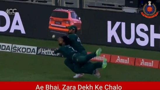 The image, taken from the viral video, shows Pakistani fielders, Shadab Khan and Asif Ali, colliding in their attempts to catch a ball hit by Sri Lankan batsman Bhanuka Rajapaksa in their last ball of the innings. (Twitter/@DelhiPolice)