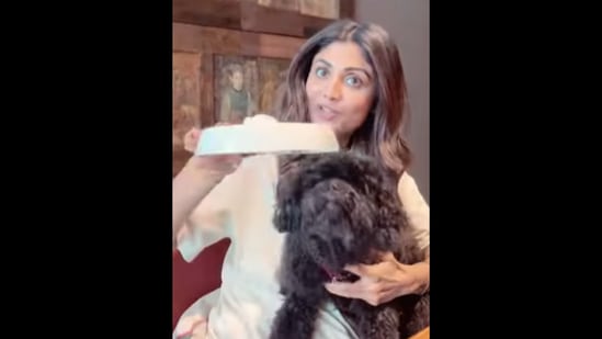 Shilpa Shetty Kundra with her pet dog Truffle who enjoys its ‘Sunday binge’ ice-cream.&nbsp;(Instagram/@theshilpashetty)