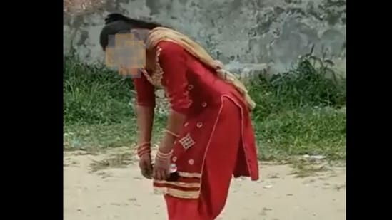 Screengrab from viral video: A woman in Maqboolpura locality in Amritsar, purportedly under the influence of drugs.&nbsp;(Twitter)