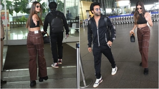 Tara Sutaria and her boyfriend, Aadar Jain, arrived at the Mumbai airport today. The couple were clicked by the paparazzi dressed in comfy ensembles, acing the casual airport fashion game. While Tara chose a crop top and trendy pants set for catching her flight, Aadar complemented the Ek Villain Returns actor in an all-black tracksuit. Keep scrolling to check out their airport pictures.(HT Photo/Varinder Chawla)