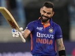 India's Virat Kohli raises his bat to celebrate scoring a century India's Virat Kohli raises his bat to celebrate scoring a century