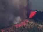 An air tanker drops fire retardant on the Washburn Fire burning in Yosemite National Park, in California, Monday, July 11.(AP)