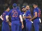 Harshal Patel (in middle) celebrates with Indian teammates Harshal Patel (in middle) celebrates with Indian teammates