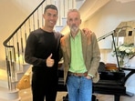 Cristiano Ronaldo poses for a photo with Jordan Peterson.