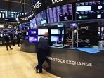 Traders work the floor of the New York Stock Exchange during morning trading on August 15, 2022 in New York City.(AFP) Traders work the floor of the New York Stock Exchange during morning trading on August 15, 2022 in New York City.(AFP)