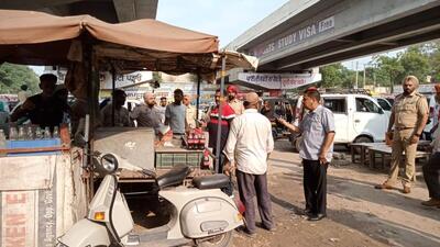 The MC team and police administration staff carrying out a drive against illegal encroachments on roads in Ludhiana. (HT PHOTO)