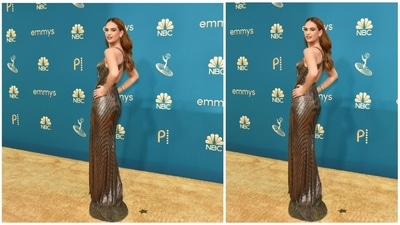 Lily James, who was nominated for the role of bombshell actress Pamela Anderson in the limited series "Pam and Tommy," wore a skin-tight bronze Versace gown with ruching at the waist. (AFP) Lily James, who was nominated for the role of bombshell actress Pamela Anderson in the limited series "Pam and Tommy," wore a skin-tight bronze Versace gown with ruching at the waist. (AFP)