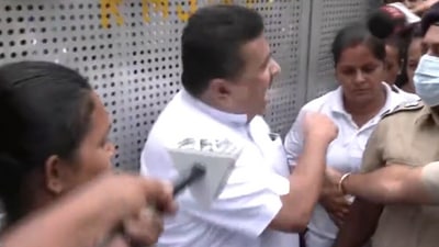 Suvendu Adhikari seen resisting arrest by a female cop in Kolkata.