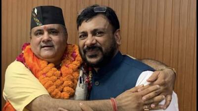 Shadab Shams (right) with BJP state unit chief Mahendra Bhatt. (HT PHOTO) Shadab Shams (right) with BJP state unit chief Mahendra Bhatt. (HT PHOTO)