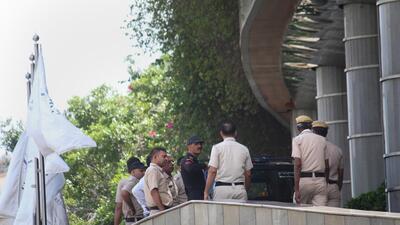 Police and a bomb disposal squad at the five-star hotel. (PTI) Police and a bomb disposal squad at the five-star hotel. (PTI)