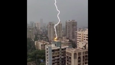 The image, taken from the viral Instagram video, shows a bolt of lightning striking a high-rise building in Mumbai's Borivali West. (Instagram/@vibhutibandekar) The image, taken from the viral Instagram video, shows a bolt of lightning striking a high-rise building in Mumbai's Borivali West. (Instagram/@vibhutibandekar)