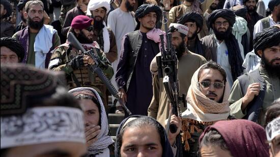 Taliban fighters celebrate the first anniversary of the withdrawal of US-led troops from Afghanistan, in Kabul. (AP)