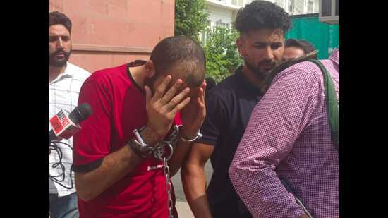 Anmol Deep Soni, a close associate of Canada-based gangster Lakhbir Singh alias Landa, outside a court in Kharar on Monday. (HT)