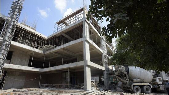 A view of the under-construction multilevel parking near Old Railway Station road in Sohna Chowk. The entire project is expected to cost around <span class='webrupee'>?</span>54 crore. (Parveen Kumar/HT PHOTO)