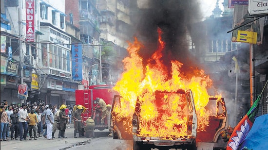 A police vehicle set on fire by some miscreants near Nakhoda Mosque in Kolkata (PTI)