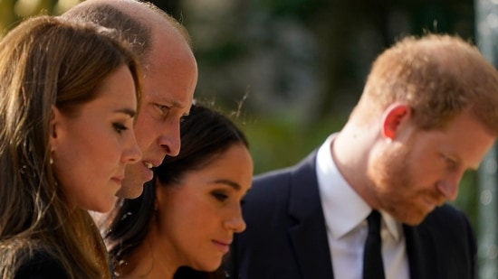 Britain's Prince William and Kate, Princess of Wales and Britain's Prince Harry and Meghan, Duchess of Sussex view the floral tributes for the late Queen Elizabeth II.(AP)