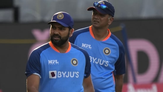 India's captain Rohit Sharma, left, and head coach Rahul Dravid watch players train ahead of the T20 cricket match of Asia Cup between Sri Lanka and India(AP)
