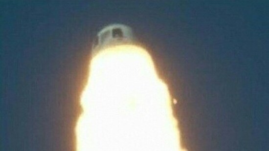 This screen grab obtained from a handout video published by Blue Origin on September 12, 2022 shows the moment when the capsule fired emergency thrusters to separate from its booster during an emergency manuever after a booster failure on Monday's uncrewed flight of the Blue Origin rocket.