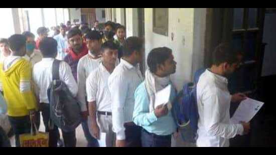 Youths queuing at the regional employment office, Prayagraj, while reporting for a job fair. (HT file)