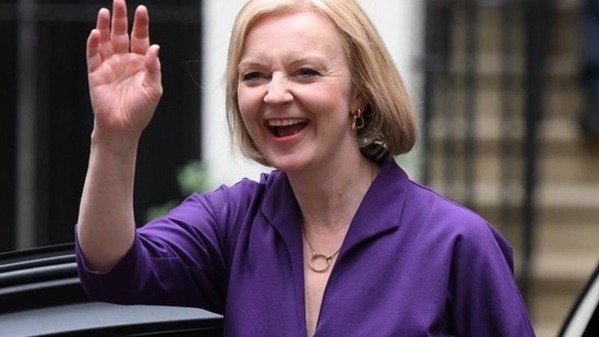UK Unemployment rate drops: UK PM Liz Truss smiles and waves.