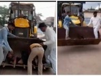 Bike accident victim being taken to hospital in JCB earthmover.(ANI)