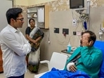 TMC MP Abhishek Banerjee interacts with Debjit Chatterjee, an assistant commissioner of Kolkata Police, who got injured during BJP's 'Nabanna Abhijan' protest march, at SSKM hospital in Kolkata, on Wednesday, September 14, 2022. (PTI Photo) TMC MP Abhishek Banerjee interacts with Debjit Chatterjee, an assistant commissioner of Kolkata Police, who got injured during BJP's 'Nabanna Abhijan' protest march, at SSKM hospital in Kolkata, on Wednesday, September 14, 2022. (PTI Photo)
