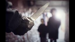 Criminal with knife weapon threatening woman and child in underpass crime (Getty Images/iStockphoto)