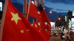 Flags of China and Taiwan flutter next to each other during a rally in Taipei, Taiwan on May 14, 2016.