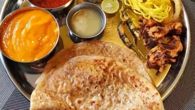 Puran Poli: This is a yellow sweet flatbread that is made with the stuffing of chana, desiccated coconut, jaggery or cane sugar, and nutmeg powder. (Instagram/@lekhas_feast) Puran Poli: This is a yellow sweet flatbread that is made with the stuffing of chana, desiccated coconut, jaggery or cane sugar, and nutmeg powder. (Instagram/@lekhas_feast)