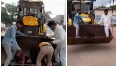 Bike accident victim being taken to hospital in JCB earthmover. (ANI) Bike accident victim being taken to hospital in JCB earthmover. (ANI)
