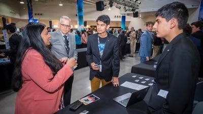 California-based Indian origin brothers Arihan (left) and Aarush Yadav share details of the Universal Messaging app they developed during the Innovation Summit at the Space Center, California-based Indian origin brothers Arihan (left) and Aarush Yadav share details of the Universal Messaging app they developed during the Innovation Summit at the Space Center,