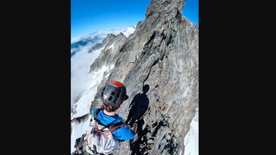 The image, taken from the Instagram video, shows the man walking on an extremely thin mountain ridge. (Instagram/@nemonisky)