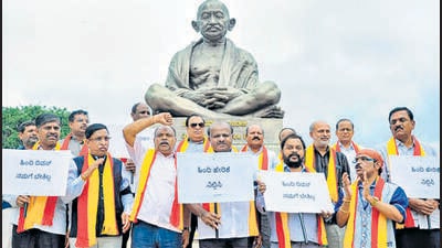 Former chief minister H D Kumaraswamy and Janata Dal (Secular) MLAs stage a protest against the celebration of Hindi Diwas, utside Karnataka assembly in Bengaluru on Wednesday. (PTI) Former chief minister H D Kumaraswamy and Janata Dal (Secular) MLAs stage a protest against the celebration of Hindi Diwas, utside Karnataka assembly in Bengaluru on Wednesday. (PTI)
