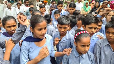 Students of a government school staging a protest in Picholia village in Karnal on Wednesday. (HT Photo)