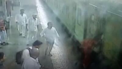 The woman, who was boarding the train with her three-year-old child, fell into the gap between the platform and the train (Screengrab/CCTV footage) The woman, who was boarding the train with her three-year-old child, fell into the gap between the platform and the train (Screengrab/CCTV footage)