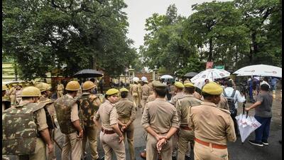 Police personnel stand guard to stop Samajwadi Party MLAs from reaching Vidhan Bhavan premises for a sit-in protest against BJP government in Lucknow on Wednesday. (PTI PHOTO) Police personnel stand guard to stop Samajwadi Party MLAs from reaching Vidhan Bhavan premises for a sit-in protest against BJP government in Lucknow on Wednesday. (PTI PHOTO)