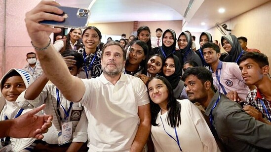 Congress leader Rahul Gandhi takes a selfie with the students at Chathannoor in Kollam during the 7th day of the Bharat Jodo Yatra on Wednesday.&nbsp;(Source: Congress/Twitter)