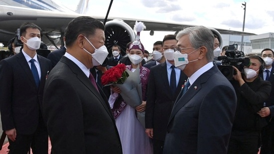 Chinese President Xi Jinping is welcomed by Kazakh President Kassym-Jomart Tokayev upon his arrival in Nur-Sultan, Kazakhstan September 14.&nbsp;(REUTERS)