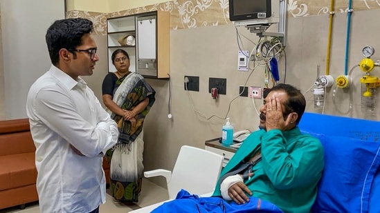 TMC MP Abhishek Banerjee interacts with Debjit Chatterjee, an assistant commissioner of Kolkata Police, who got injured during BJP's 'Nabanna Abhijan' protest march, at SSKM hospital in Kolkata, on Wednesday, September 14, 2022. (PTI Photo)
