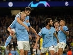 Manchester City's Erling Haaland, left, celebrates after scoring his side's 2nd goal during the group G Champions League soccer match between Manchester City and Borussia Dortmund at the Etihad stadium in Manchester Manchester City's Erling Haaland, left, celebrates after scoring his side's 2nd goal during the group G Champions League soccer match between Manchester City and Borussia Dortmund at the Etihad stadium in Manchester