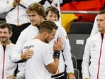 Germany's Jan-Lennard Struff, front, celebrates with teammate Alexander Zverev after defeating Benjamin Bonzi of France in a Davis Cup group C match(AP) Germany's Jan-Lennard Struff, front, celebrates with teammate Alexander Zverev after defeating Benjamin Bonzi of France in a Davis Cup group C match(AP)