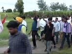 Mortal remains of the victims being taken by their family and others for their last rites. (ANI Photo)