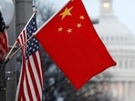 China flag and the US flag on a lamp post along Pennsylvania Avenue near the US Capitol in Washington, DC. China flag and the US flag on a lamp post along Pennsylvania Avenue near the US Capitol in Washington, DC.