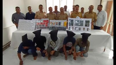 The Manpada police in Dombivli with the mobile phones seized from the five persons arrested. The five were using fake Aadhaar cards to cheat e-commerce websites. (PRAMOD TAMBE/HT PHOTO)