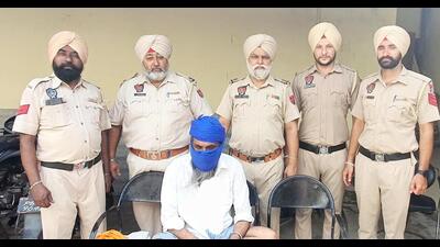 Kapurthala police on Thursday arrested Lattianwal sarpanch Balvir Singh after a few arrested peddlers disclosed his involvement in drug deals. (HT Photo) Kapurthala police on Thursday arrested Lattianwal sarpanch Balvir Singh after a few arrested peddlers disclosed his involvement in drug deals. (HT Photo)